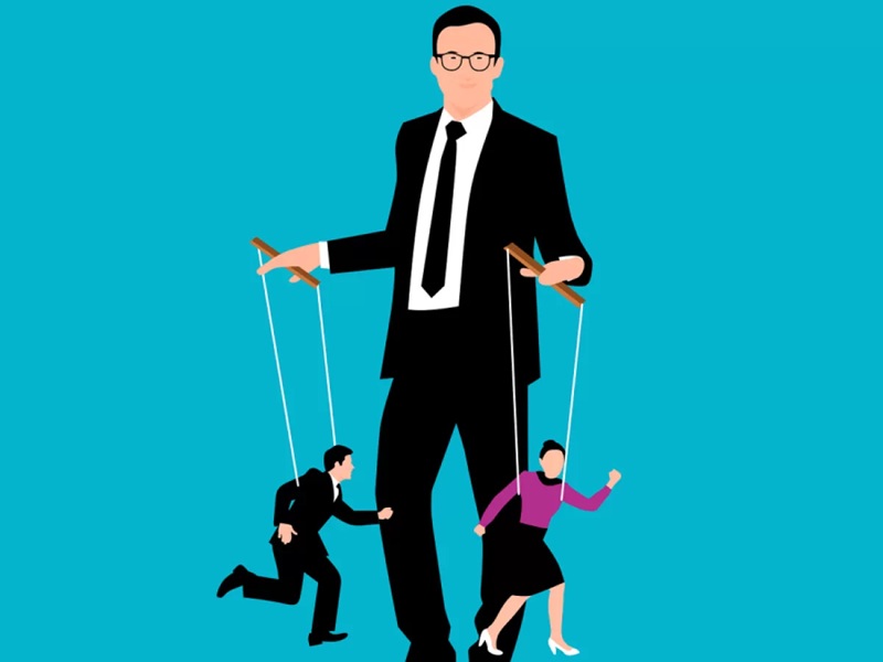 Hình ảnh người mặc vest điều khiển người khác như con rối